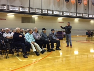 man speaking to crowd